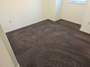 A clean room featuring dark brown carpet, likely after a professional service by Alaska Floor Care Specialists in Fairbanks, AK.