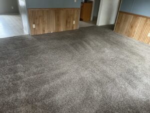 A clean dark grey carpet in a room after professional service by American Dream Carpet Cleaning in Cedar Rapids, IA.