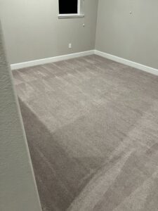 A clean carpet in an empty room showing professional cleaning lines by California Xtreme Steam in Sacramento, CA