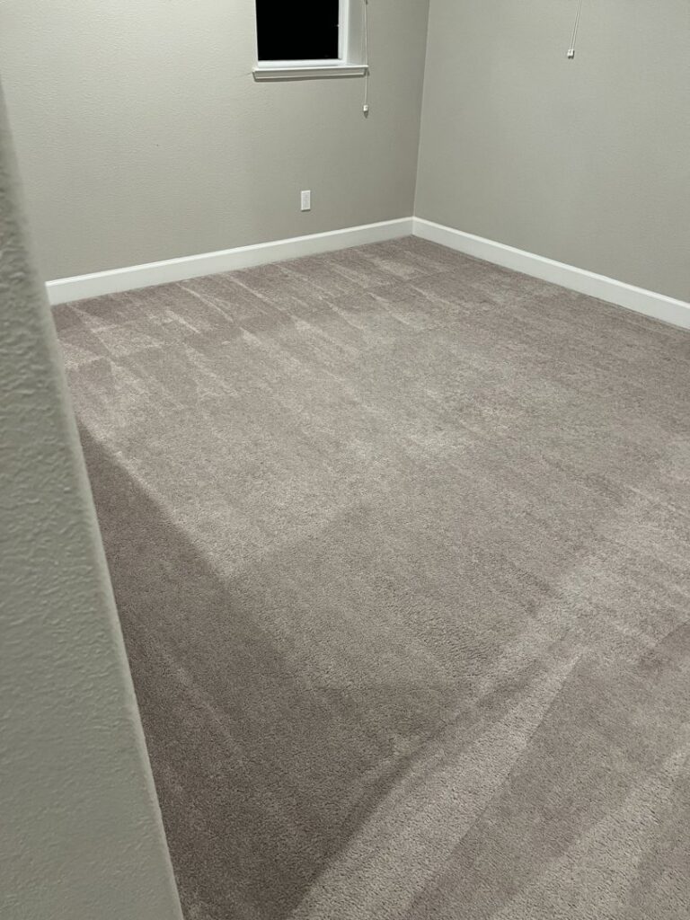 A clean carpet in an empty room showing professional cleaning lines by California Xtreme Steam in Sacramento, CA