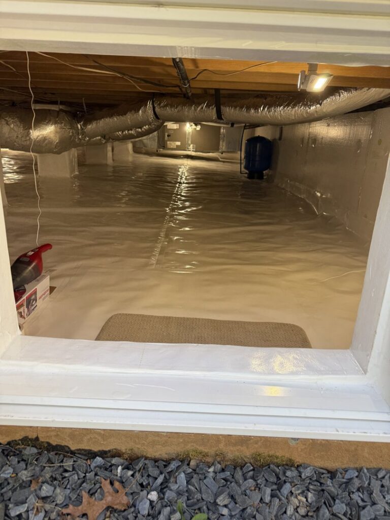 A view into a clean, encapsulated crawlspace, showing completed work by Central Virginia Exterminating & Crawlspace Solutions in Dillwyn, VA.