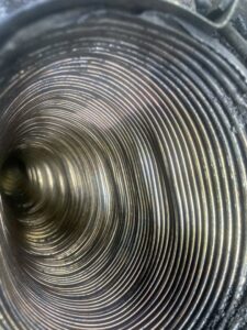 A clean, flexible chimney liner, a component of a safe chimney system by Chimney Cricket Cleaning Service in Marshfield, MO