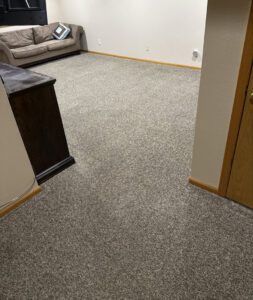 A clean, plush grey carpet in a room after professional cleaning by North Colorado Kwik Dry Total Cleaning in Johnstown, CO.