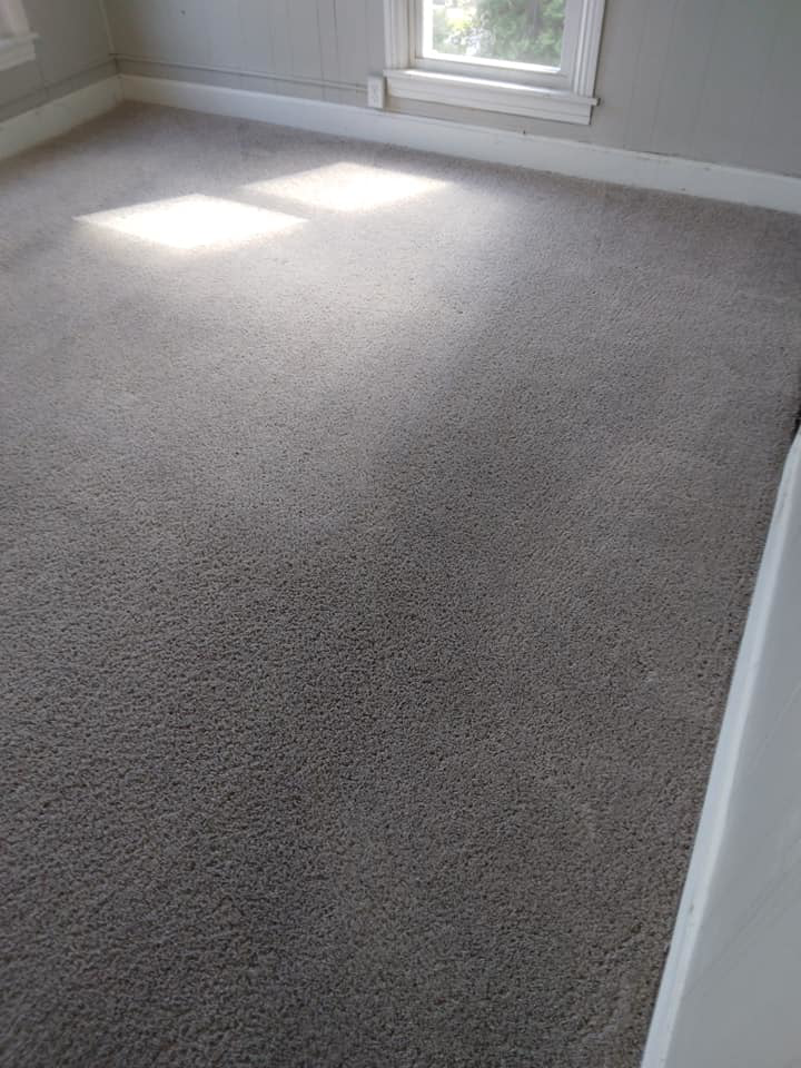 A clean grey carpet in a residential room by Magic Carpet Cleaning in Pittsburgh, PA.