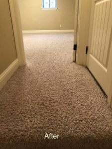 A hallway with freshly cleaned light brown carpet after service by Absolutely Clean Carpet Care in Bossier City, LA
