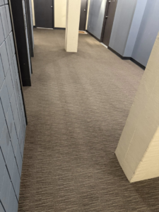 A clean, striped hallway carpet after professional service by Midwest Carpet Rescue in Omaha, NE.
