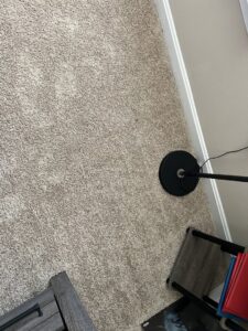 A clean, light brown carpet in a room, showcasing a successful cleaning service by Hippo Cleaning Services in Rockville, MD.