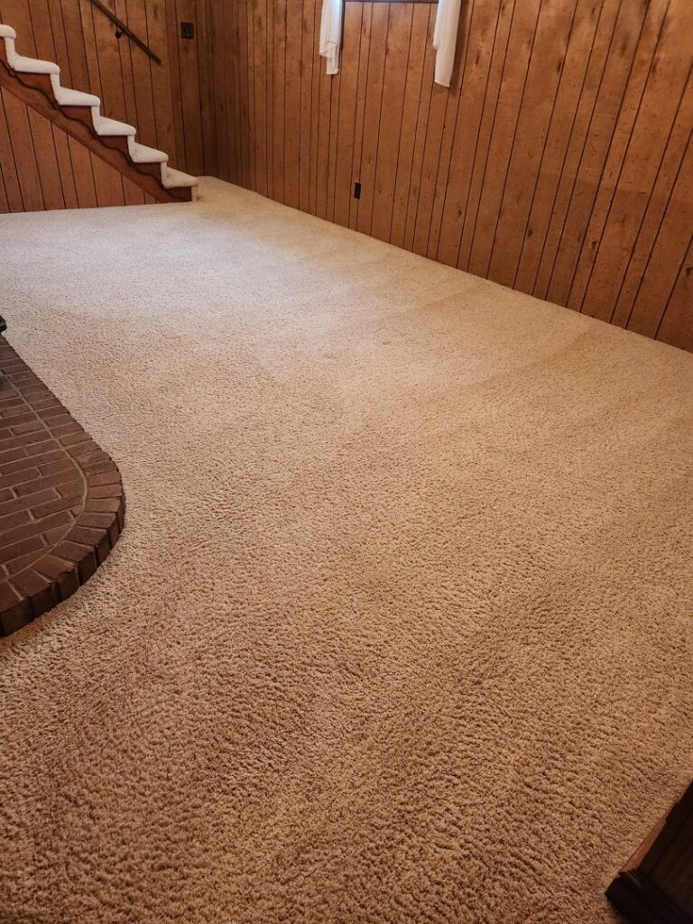 A clean light brown carpet in a living room after professional cleaning by Heaven's Best Carpet Cleaning Idaho Falls ID.