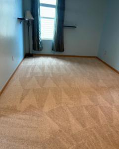 A clean light brown carpeted room showing distinct cleaning patterns after service by Capital City Floor Care LLC in Columbus, OH.