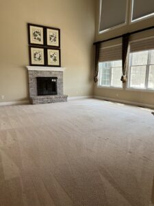 A large, clean, light-colored carpet in a living room after professional cleaning by Get Green Carpet Cleaning CT in West Hartford, CT.