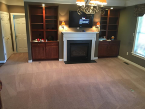 A freshly cleaned living room carpet with visible vacuum lines by All Virginia Cleaning Solutions, LLC. in Henrico, VA.