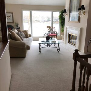 A beautifully cleaned, light-colored carpet in a residential living room by Eco Carpet Cleaning in Indianapolis, IN.
