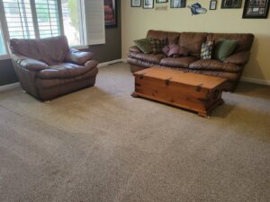 Cleaned carpet in a living room with furniture after service by Revolution Carpet Cleaners in Chandler, AZ