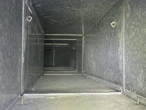 A view inside a clean metal air duct after thorough cleaning by Vacman Air Duct Cleaning in South Bend, IN