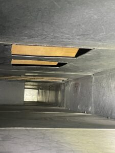 A view inside a clean metal air duct, showcasing the thorough cleaning by Vacman Air Duct Cleaning in South Bend, IN