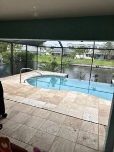 A clean outdoor pool deck with tiled flooring after service by Captain Steamer in Cape Coral, FL.