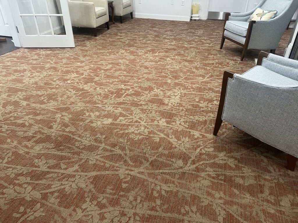 A clean, patterned carpet in a commercial space, showcasing the expertise of JDog Carpet Cleaning & Floor Care Alpharetta in Roswell, GA.