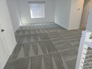 A clean patterned carpet in a room after service by KD Carpet Cleaning in Cape Coral, FL
