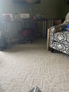 A clean patterned carpet in a living room after professional service by Fiber Dry Carpet & Upholstery Cleaning in Dayton, OH.