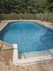 A sparkling clean inground pool being filled with fresh water by Westside Pools in Owensboro, KY.