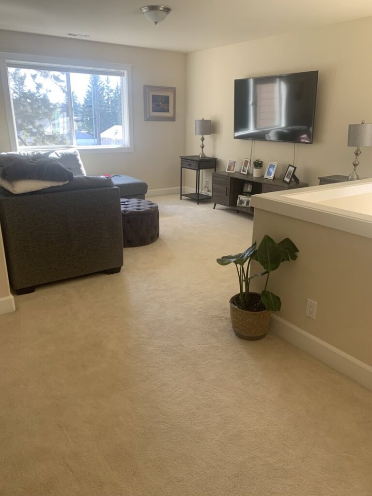 A clean residential carpet in a living area, showcasing the results of Clean-Master's service in Coeur d'Alene, ID.