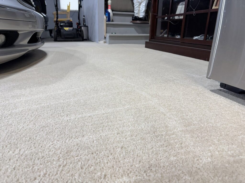 Freshly cleaned, light-colored residential carpet, showcasing the quality work of Strictly Tile & Carpet Care in Lansing, MI.