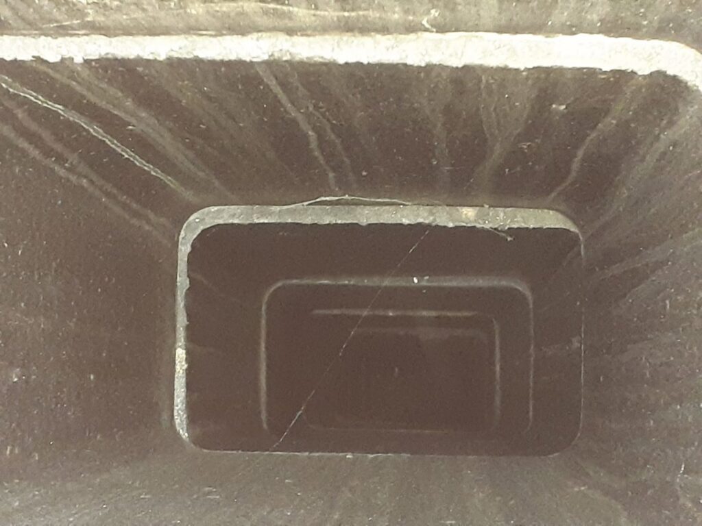 An interior view of a clean, square chimney flue, demonstrating the results of a professional chimney sweep by Colombus Chimney in Elizabeth, NJ.