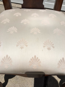 A clean, stain-free upholstered dining chair after professional cleaning by Erich's Carpet Care in Blue Springs, MO