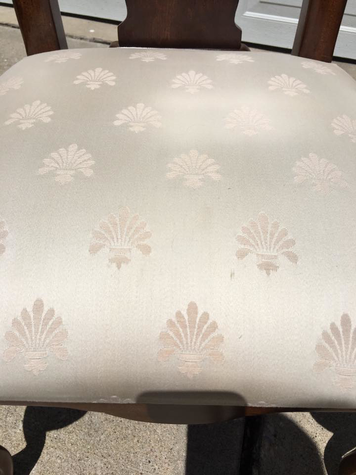A clean, stain-free upholstered dining chair after professional cleaning by Erich's Carpet Care in Blue Springs, MO