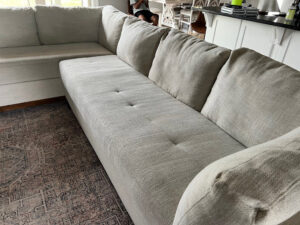 A clean upholstered sectional sofa after professional cleaning by Pure Steam Carpet Cleaning in Nashville, TN