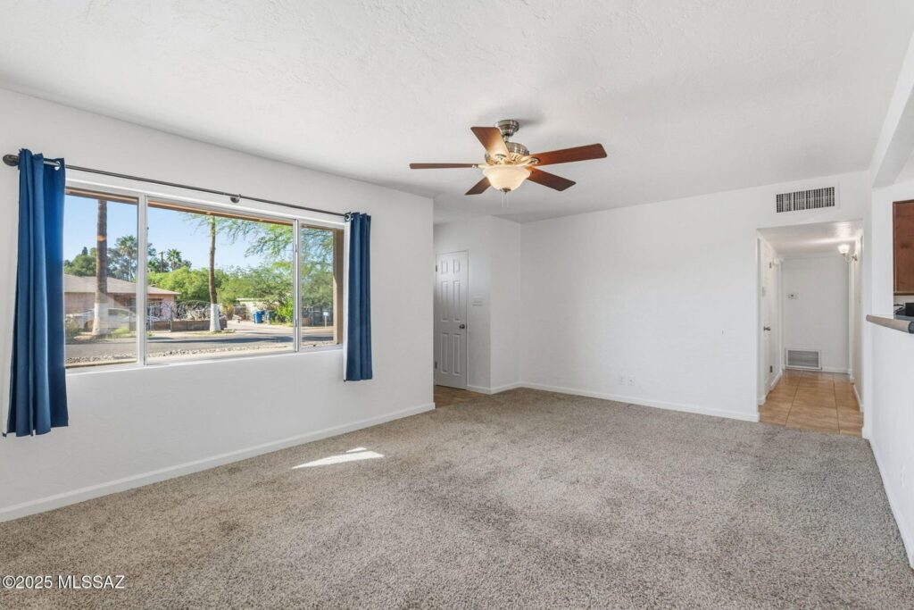 A clean, empty room featuring wall-to-wall carpet installed or maintained by Alameda Carpet & Upholstery Cleaners in Portland, OR.