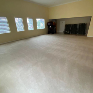 A large room with freshly cleaned wall-to-wall carpet by GTS future cleaning services in Los Angeles, CA