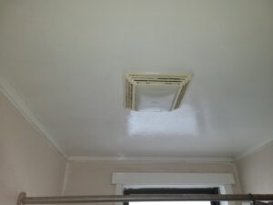 A clean bathroom ceiling with an exhaust fan after successful mold remediation by Air Care & Restoration Co. in Bethlehem, PA.