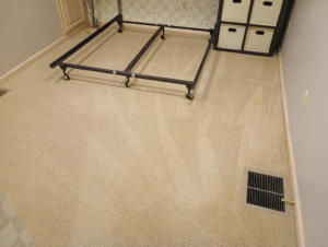 Cleaned bedroom carpet with a bed frame and storage unit by Rowland Brothers Carpet Cleaning Service in Morgantown, WV