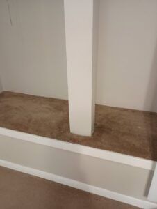 A section of freshly cleaned carpet around a white pillar by All Steamed Up Carpet/Upholstery Cleaning in Havana, FL
