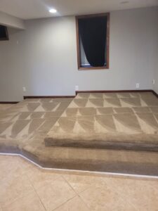 Professionally cleaned carpet on stairs and a raised platform, showing patterns from Leo's Carpet Cleaning in Omaha, NE