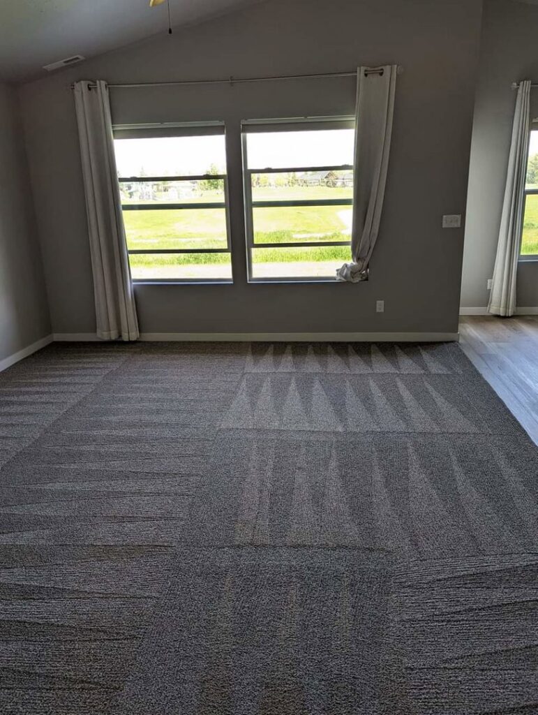 A room with carpet tiles showing fresh cleaning lines after service by Spot On Carpet Cleaning of Columbia, SC.