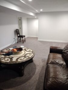 A freshly cleaned carpeted living room with visible vacuum lines by Ready2go Professional Carpet & Upholstery Cleaning in Boston, MA