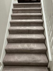 Professionally cleaned carpeted stairs with visible cleaning patterns by California Xtreme Steam in Sacramento, CA
