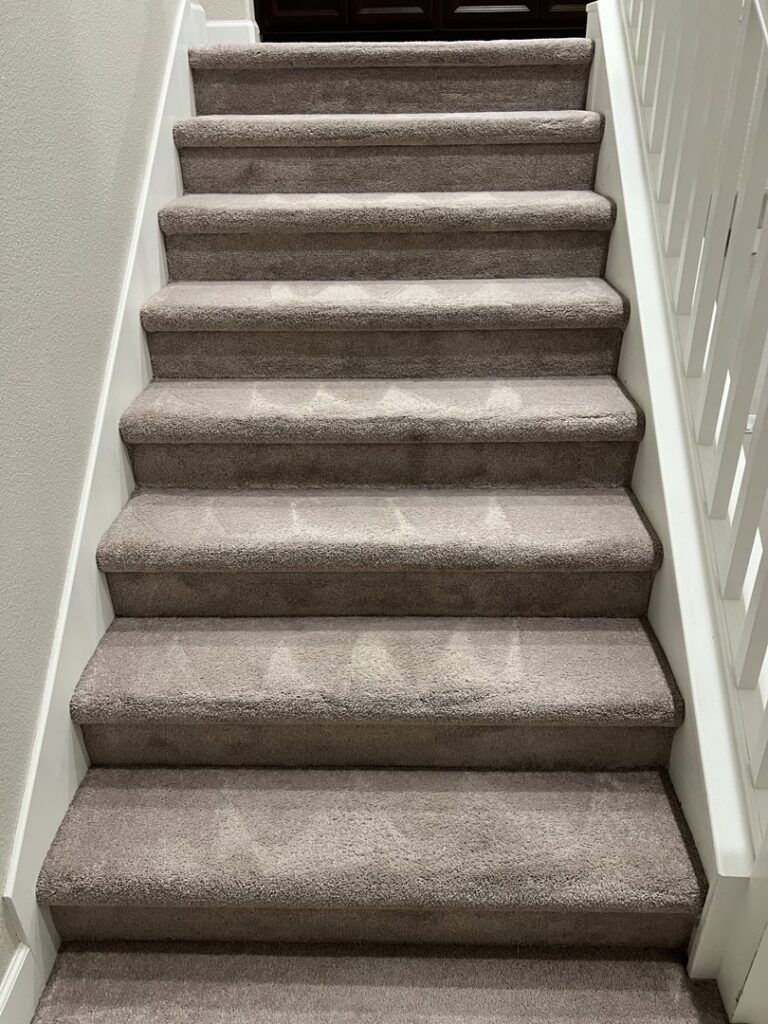 Professionally cleaned carpeted stairs with visible cleaning patterns by California Xtreme Steam in Sacramento, CA