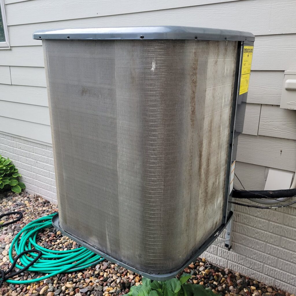 A thoroughly cleaned outdoor AC condenser unit after service by Trade Allies Heating and Cooling in Ankeny, IA.