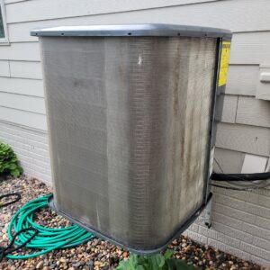 A thoroughly cleaned outdoor AC condenser unit after service by Trade Allies Heating and Cooling in Ankeny, IA.
