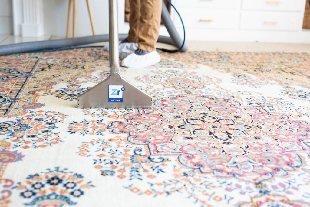 A professional cleaning wand being used to clean an intricate area rug by Zerorez Greenville, SC.
