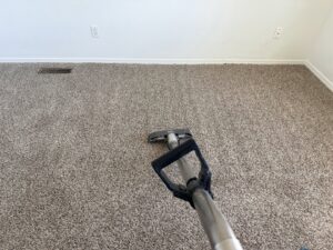 Cleaning a dirty carpet with a professional wand, showing the clean path, by KD Carpet Cleaning in Cape Coral, FL