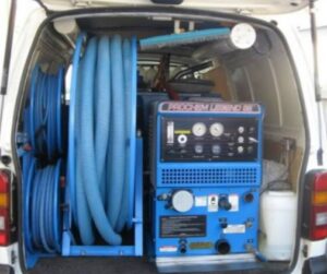 A carpet cleaning wand in action on a striped carpet by Carpet Cleaning Stamford in Stamford, CT