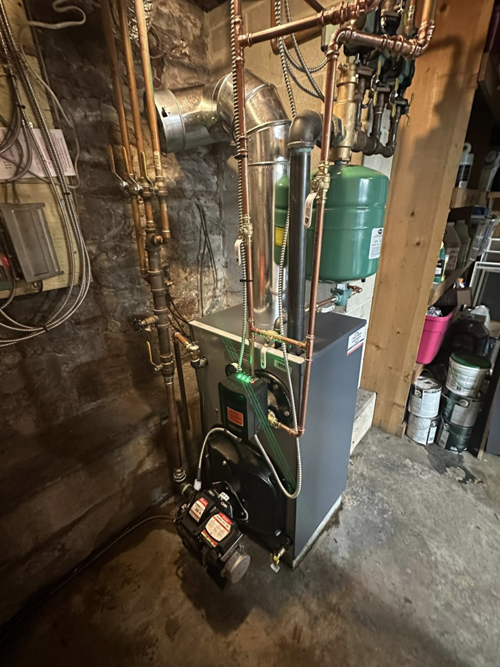 A close-up view of a boiler system's burner and controls installed by Tapper Energy in Dauphin, PA.