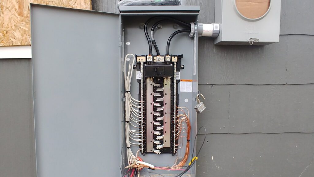 A close-up view of electrical bus bars and wiring inside a service panel by A Renewable Electric LLC in Houston, TX.