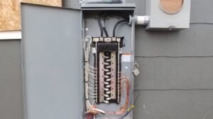 A close-up view of electrical bus bars and wiring inside a service panel by A Renewable Electric LLC in Houston, TX.