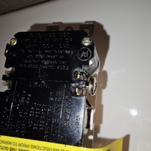 A close-up view of the back of an electrical outlet, showing wiring details by Bee Thumb Electric in North Highlands, CA.