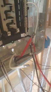 A close-up view of an electrical panel interior with various wires connected by 2 Phase Electric LLC in Barnesville, MN.